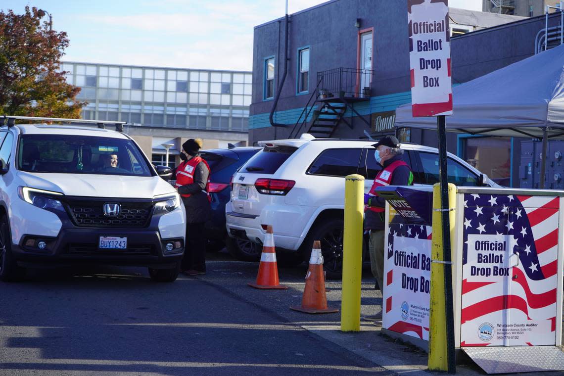 Whatcom County voters are assisted at the drive-up ballot box near the Whatcom County Courthouse on Election Day Tuesday, Nov. 8, in Bellingham.