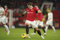 Manchester United's Marcel Sabitzer takes the ball forward during the English Premier League soccer match between Manchester United and Leeds United at Old Trafford in Manchester, England, Wednesday, Feb. 8, 2023. (AP Photo/Dave Thompson)