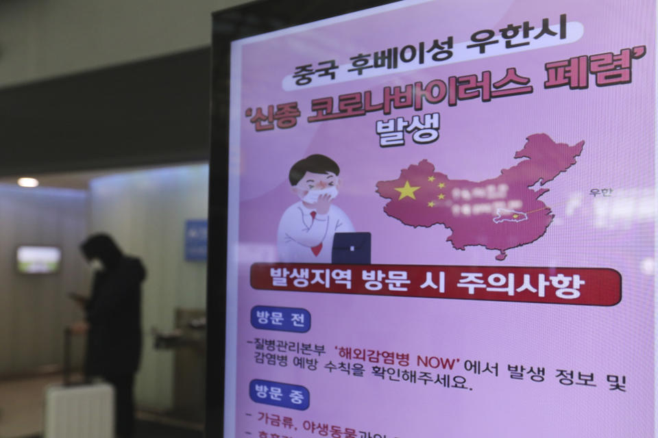 A poster warning about coronavirus is displayed in a departure lobby at Incheon International Airport in Incheon, South Korea, Monday, Jan. 27, 2020. China on Monday expanded sweeping efforts to contain a viral disease by extending the Lunar New Year holiday to keep the public at home and avoid spreading infection. The sign reads " A new coronavirus occurs in Wuhan City, China." (AP Photo/Ahn Young-joon)