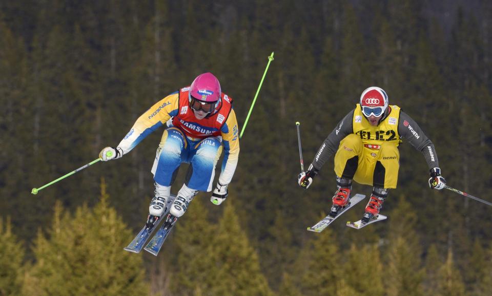Winner Sweden's Victor Ohling Norberg, left, in action during the men's FIS Ski Cross World Cup in Are, Sweden, Saturday March 15, 2014. (AP Photo/Janerik Henriksson) SWEDEN OUT