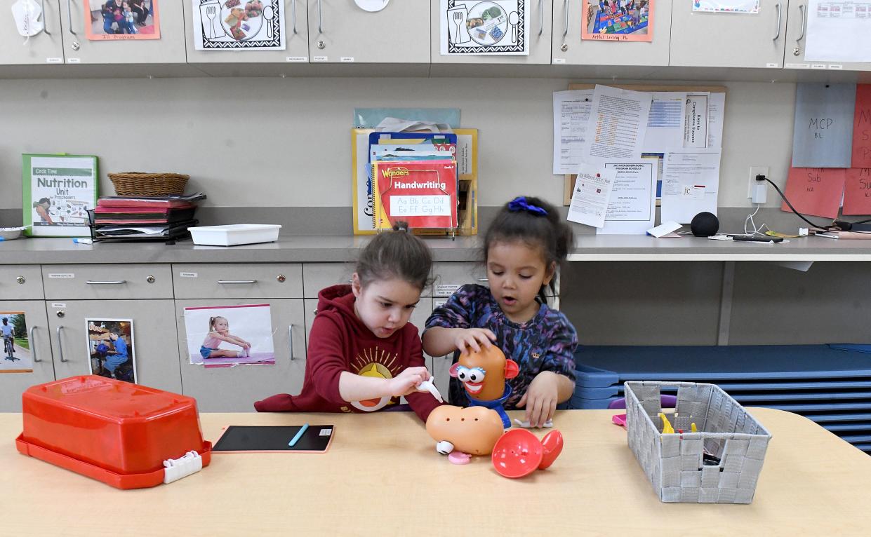 Elleri Knot, 3, and Jaycee Lewis, 3, play together at the JRC Learning Center on Parkway Street NW in Canton Township.