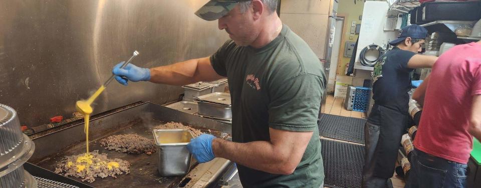 Philly's Finest owner Jeff Harris makes cheesesteaks on Monday to be delivered to Coach Doug Pederson and the Jacksonville Jaguars on behalf of the Philadelphia Eagles after Sunday's win against the Dallas Cowboys.