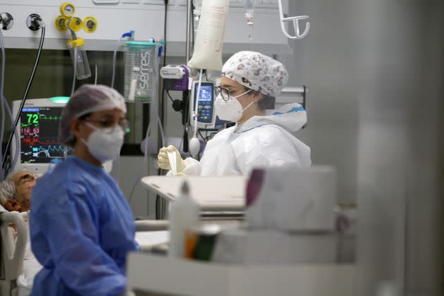 BARI, ITALY - NOVEMBER 12: Nurses assist the Covid-19 infected patients in the new ward, set up in the Fiera del Levante, on November 12, 2021 in Bari, Italy. Italy are now offering COVID-19 booster vaccinations to those over 40 years of age in an effort to avoid the latest wave of the disease, which has hit several European countries. (Photo by Donato Fasano/Getty Images) (Photo: Donato Fasano via Getty Images)