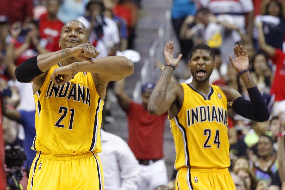 Indiana Pacers forward David West (21) and Indiana Pacers forward Paul George (24) react to a call during the second half of Game 4 of an Eastern Conference semifinal NBA basketball playoff game against the Washington Wizards in Washington, Sunday, May 11, 2014. (AP Photo/Alex Brandon)