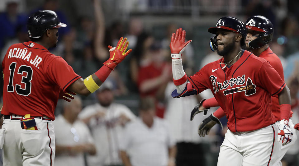 Atlanta Braves' Michael Harris II, right, celebrates with Ronald Acuña Jr. (13) after hitting a two-run home run in the eighth inning of a baseball game against the Washington Nationals on Friday, July 8, 2022, in Atlanta. (AP Photo/Ben Margot)