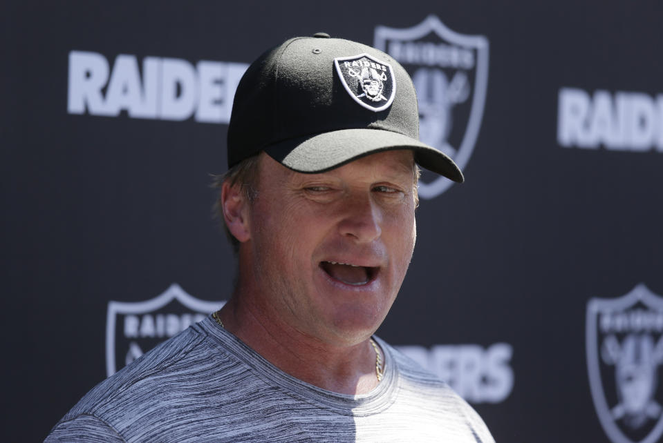 Oakland Raiders head coach Jon Gruden talks with reporters during NFL football minicamp Tuesday, June 11, 2019, in Alameda, Calif. (AP Photo/Eric Risberg)