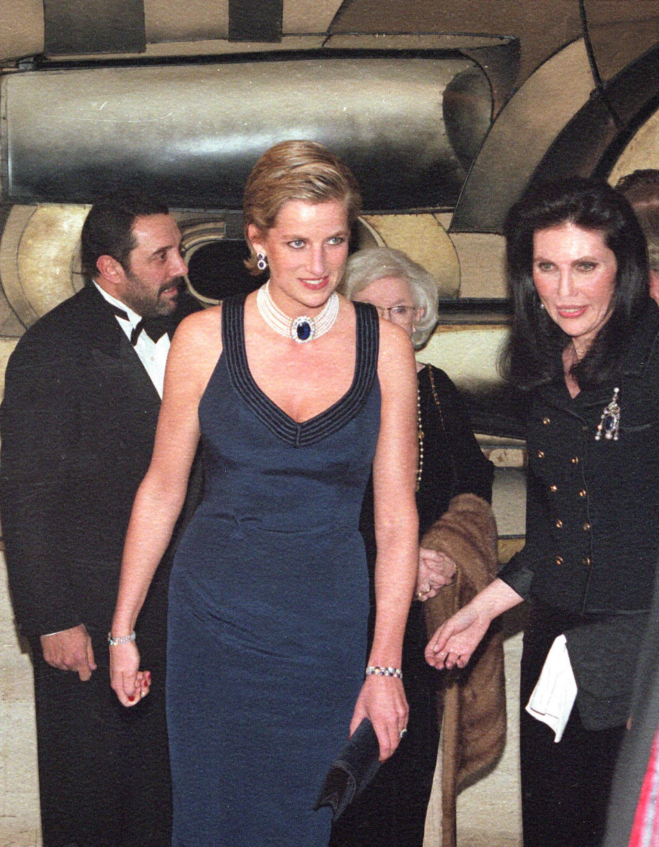 FILE - Princess Diana makes her entrance at the awards gala of the Council of Fashion Designers of America at New York's Lincoln Center, Jan. 30, 1995. (AP Photo/Clark Jones, file)