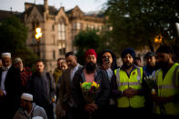 <p>People pray after a vigil in Albert Square, Manchester, England, Tuesday May 23, 2017, the day after the suicide attack at an Ariana Grande concert that left 22 people dead as it ended on Monday night. (AP Photo/Emilio Morenatti) </p>