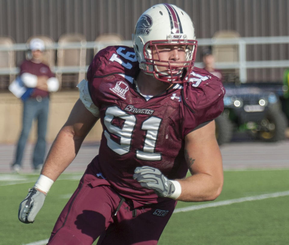 <p>In this undated photo, provided by Southern Illinois University, Jason Seaman, a defensive end for the SIU football team, participates in a game in Carbondale, Ill. Seaman, now a science teacher at Noblesville West Middle School in Noblesville, Ind., subdued a student armed with two handguns who opened fire inside his classroom Friday, May, 25, 2018 . The assailant wounded classmate and Seaman whose swift intervention was credited with saving lives. (Photo: Southern Illinois University via AP) </p>