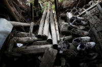 Abandoned shoes are seen in an old dwelling at a minority village which was destroyed in the 2008 Sichuan earthquake, on a mountain in Wenchuan county, Sichuan province, China, April 5, 2018. REUTERS/Jason Lee