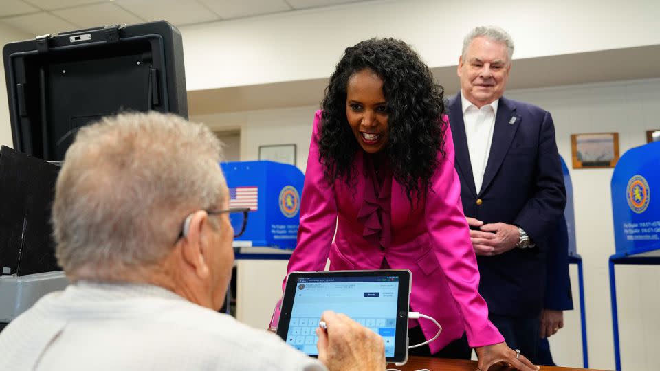 Nassau County Legislator Mazi Pilip, seen here with former New York Rep. Peter King, right, arrives to cast her ballot during early voting in Massapequa, New York, on February 9, 2024. - Adam Gray/Bloomberg/Getty Images