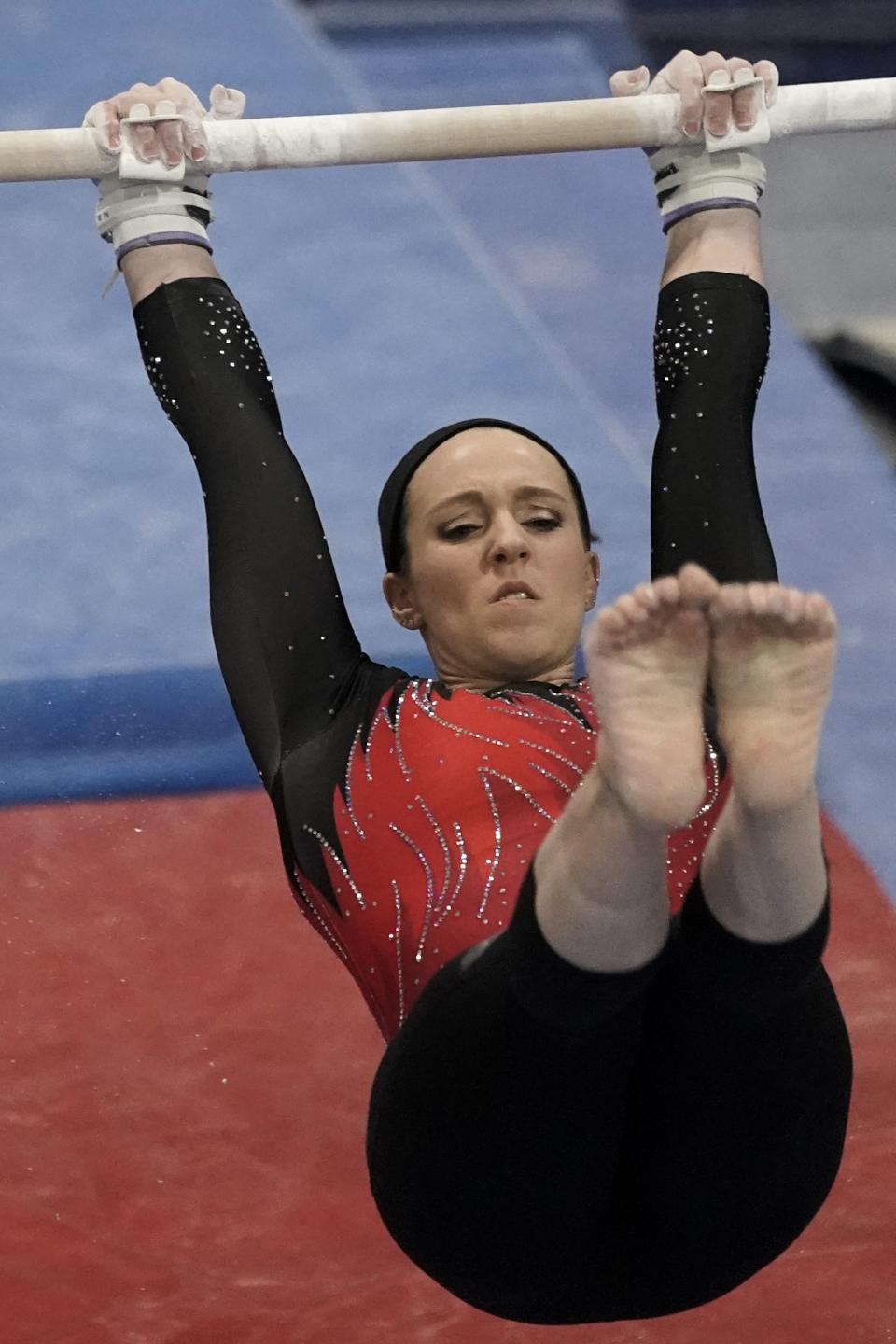 Chellsie Memmel works out Thursday, Feb. 18, 2021, in New Berlin, Wisc. The 32-year-old former world champion, Olympic silver medalist married mother of two is attempting to return to competition following a nearly decade-long break. (AP Photo/Morry Gash)