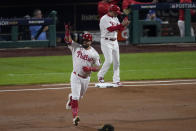 Philadelphia Phillies' Kyle Schwarber celebrates his home run during the first inning in Game 3 of the baseball NL Championship Series between the San Diego Padres and the Philadelphia Phillies on Friday, Oct. 21, 2022, in Philadelphia. (AP Photo/Matt Rourke)