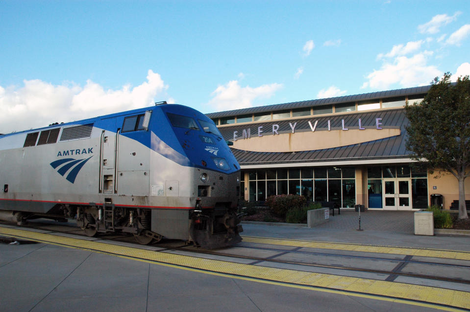 This undated image provided by Amtrak shows the California Zephyr train at the Emeryville Station 11 miles east of San Francisco, en route to Reno, Nev., a 236-mile journey that offers beautiful views as well as history. It crosses the Sierra Nevada mountain range and follows the same course as the historic Transcontinental Railroad, a 19th century engineering feat that bolstered the nation’s western expansion. The Zephyr’s ultimate destination is Chicago, a 51-hour trip from Emeryville. (AP Photo/Amtrak/Phil Gosney)