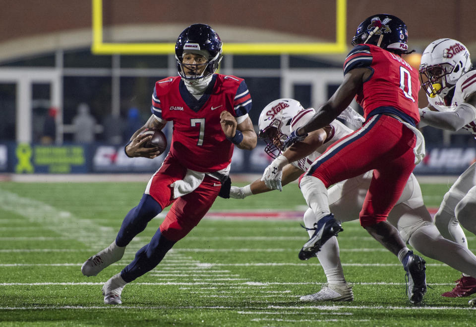 Liberty's Kaidon Salter carries against New Mexico State during the first half of the Conference USA championship NCAA college football game Friday, Dec. 1, 2023, in Lynchburg, Va. (AP Photo/Robert Simmons)