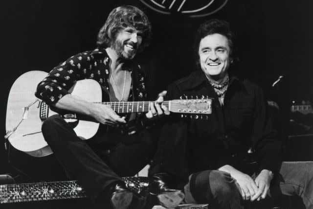 <p>Bettmann Archive</p> Kris Kristofferson and Johnny Cash perform on 'The Johnny Cash Show' in 1976.