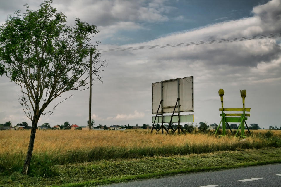 billboard on the side of the road