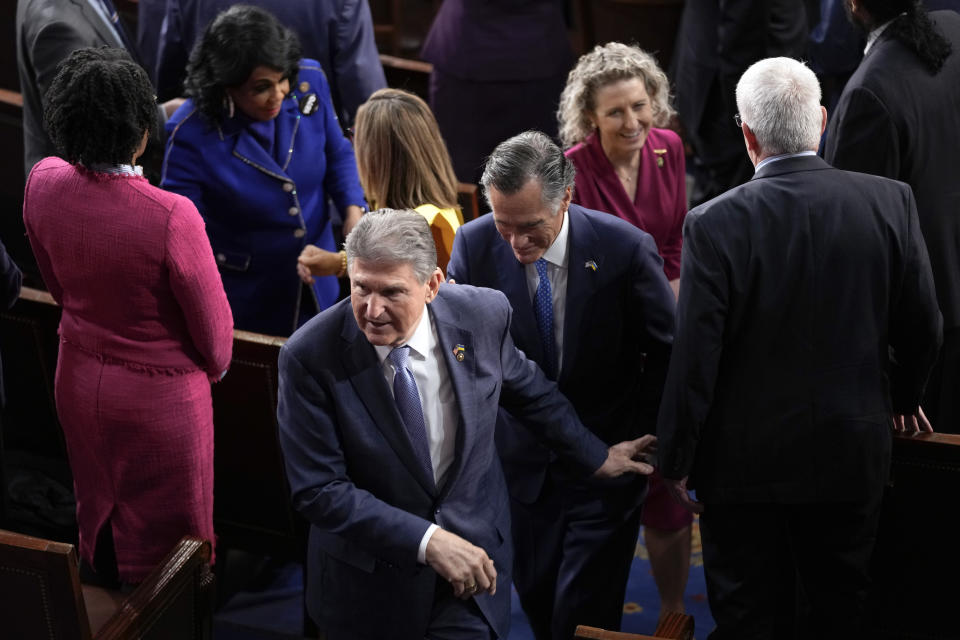 Sen. Joe Manchin, D-W.Va., and Sen. Mitt Romney, R-Utah, leave after President Joe Biden delivered the State of the Union address to a joint session of Congress at the U.S. Capitol, Tuesday, Feb. 7, 2023, in Washington. (AP Photo/Patrick Semansky)