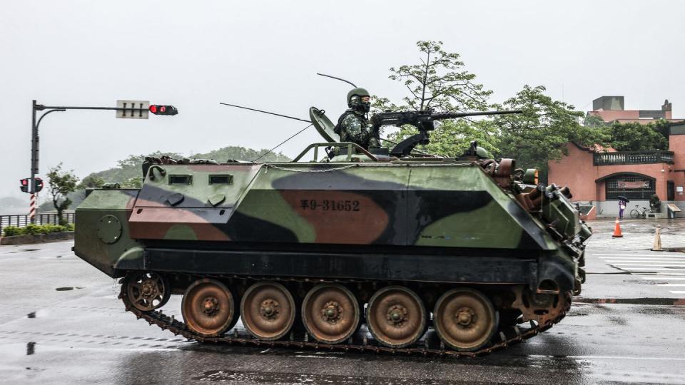 A Taiwanese armored vehicle rolls down a street in Kinmen on May 24, 2024. China warned that day that Taiwan's leadership was pushing the self-ruled island into 