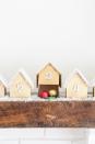 <p>Upgrade your advent calendar tradition with this DIY version from<a href="https://sugarandcharm.com/diy-wooden-houses-advent-calendar" rel="nofollow noopener" target="_blank" data-ylk="slk:Sugar and Charm;elm:context_link;itc:0;sec:content-canvas" class="link "> Sugar and Charm</a>. The little wooden houses are surprisingly easy to make and they're the perfect thing to line the mantle. </p>