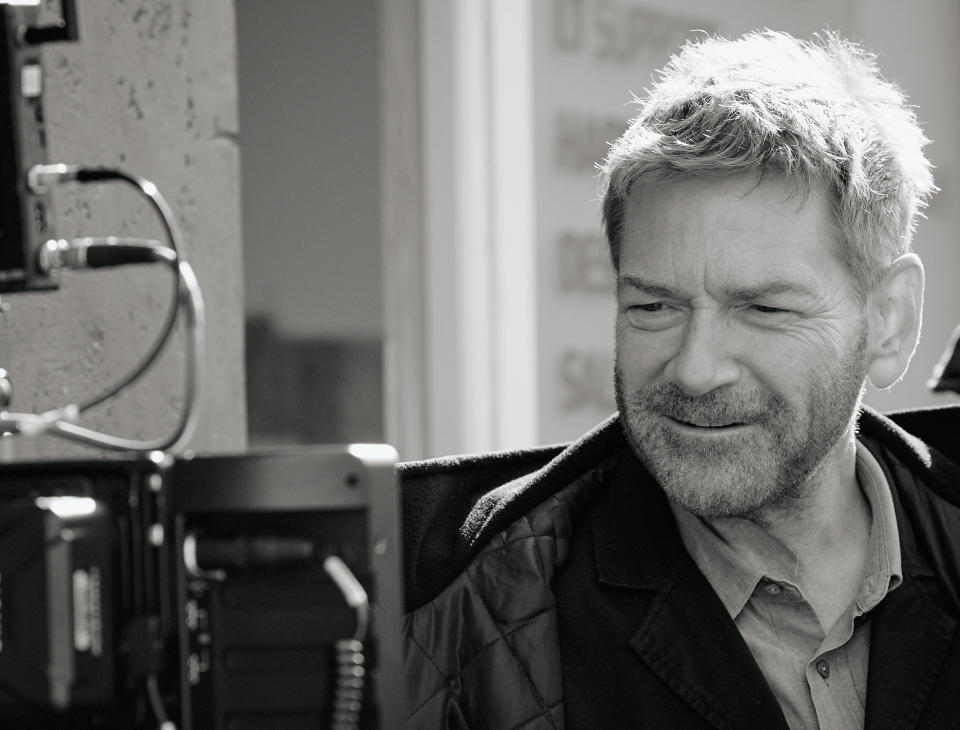 This image released by Focus Features shows writer-director Kenneth Branagh on the set of "Belfast." (Rob Youngson/Focus Features via AP)