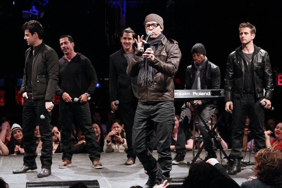 FILE - In this Jan. 22, 2013 file photo provided by Starpix, New Kids on the Block members, from left, Jordan Knight, Danny Wood, Jonathan Knight, Donnie Wahlberg, and Joey McIntyre, far right, perform during the announcement of "The Package Tour," in New York. It's a crowded tour market and everyone is competing for your entertainment dollar. New Kids on the Block paired up with 98 Degrees and Boyz II Men for the aptly titled The Package Tour. (AP Photo/Starpix, Kristina Bumphrey, file)