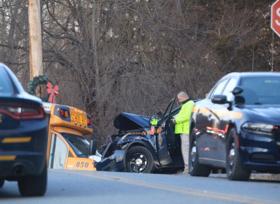 New York State Police investigate the scene of a crash between an Arlington Central School District bus and a New York State Police cruiser in LaGrange on March 8, 2022. 