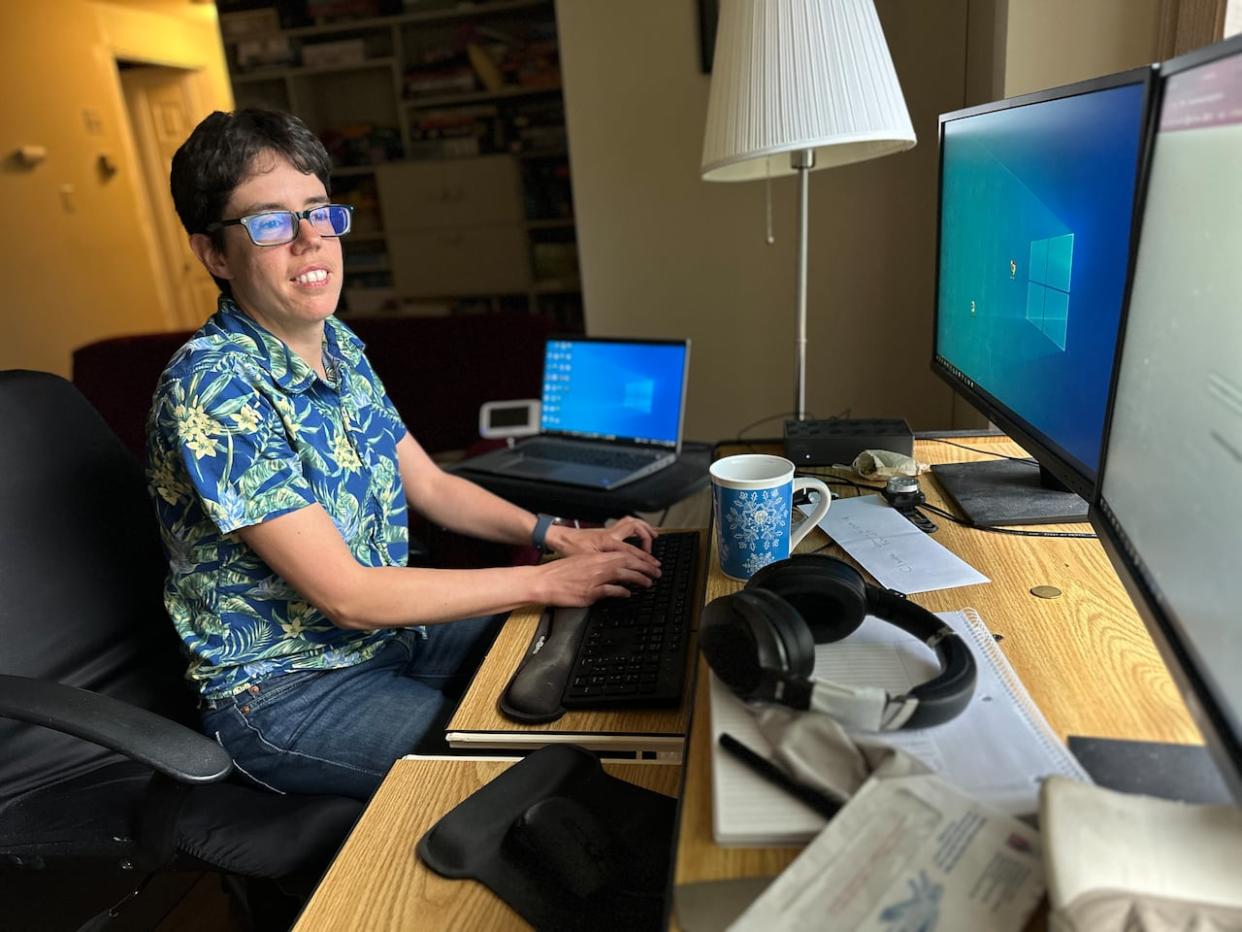 From her home office, programmer and federal public servant Claudie Larouche fine-tunes her searchable website of city activities. (Stu Mills/CBC - image credit)