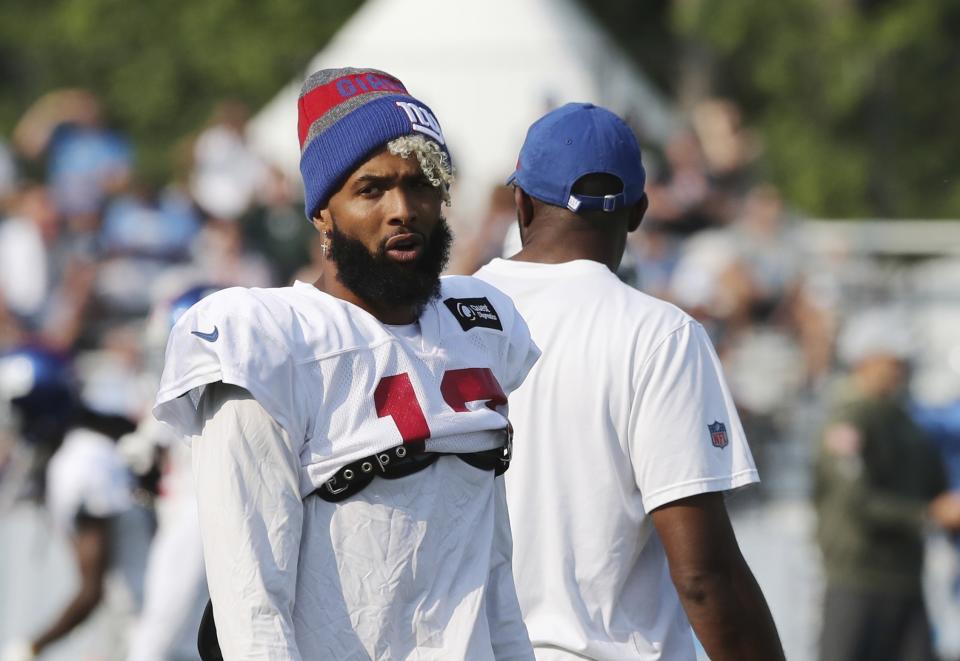 New York Giants receiver Odell Beckham Jr., walks on the field at the Detroit Lions football training facility, Tuesday, Aug. 14, 2018, in Allen Park, Mich. (AP Photo/Carlos Osorio)