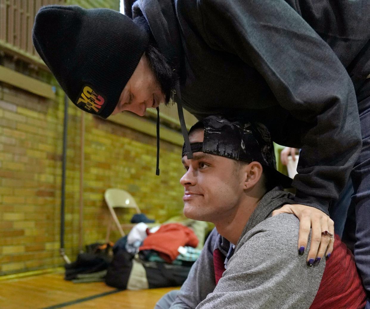 Jerred Mcpherson, 24, and his fiancée, Jeana Clark, 40, who have been living in shelters for the past two months, share a moment on Wednesday at Broad Street United Methodist Church, where a warming center is operated by the Columbus Coalition for the Homeless. The Community Shelter Board and partner agencies were conducting an annual count of homeless people on Wednesday.