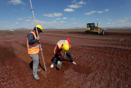 Workers are seen at the construction site of a new International airport at Texcoco, on the outskirts of Mexico City, Mexico October 25, 2016. REUTERS/Henry Romero