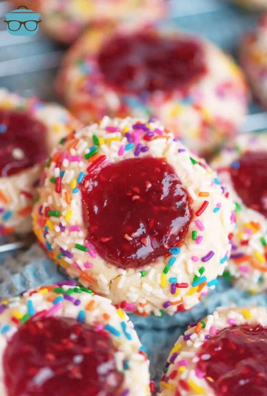 <p>The Country Cook</p><p>A classic cookie with a twist, these Raspberry Thumbprint Cookies are a favorite holiday cookie that have minimal ingredients and bake up quickly!</p><p><strong>Get the recipe: <a href="https://www.thecountrycook.net/raspberry-thumbprint-cookies/" rel="nofollow noopener" target="_blank" data-ylk="slk:Raspberry Thumbprint Cookies;elm:context_link;itc:0;sec:content-canvas" class="link rapid-noclick-resp">Raspberry Thumbprint Cookies</a></strong></p>