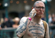 <p>A visitor to the London Tattoo Convention shows off his tattoos, in London, Britain, Sept. 23, 2017. (Photo: Peter Nicholls/Reuters) </p>