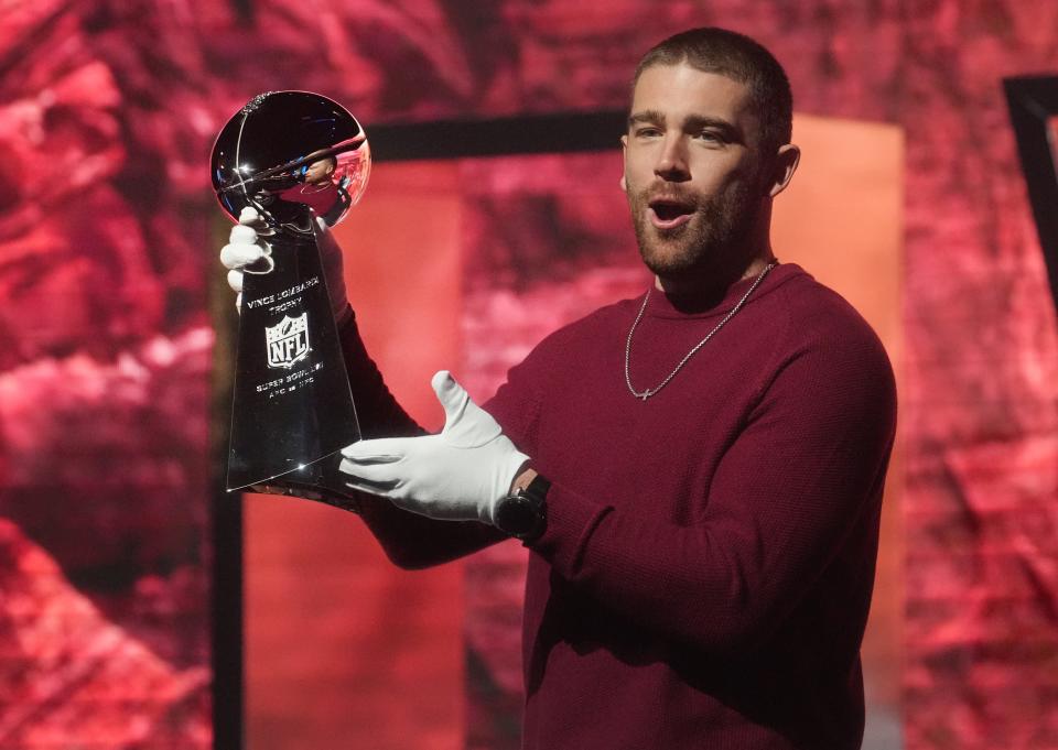 Zach Ertz carries the Vince Lombardi trophy at the NFL's Super Bowl Experience at the Phoenix Convention Center downtown Phoenix on Saturday, Feb. 4, 2023.