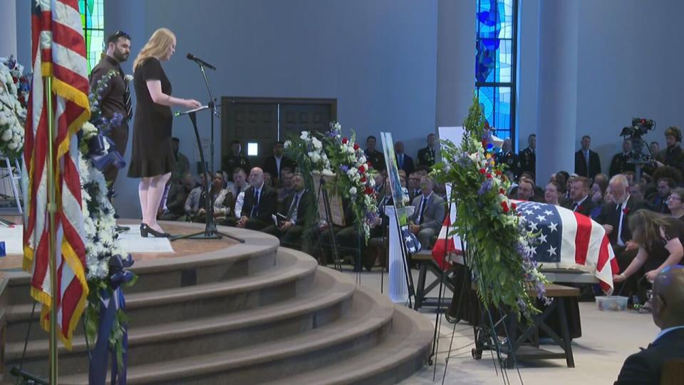 Ashley Eyer, wife of CMPD officer Joshua Eyer, speaks at the funeral.