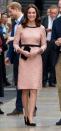 <p>At Paddington Station, the Duchess wore a peachy-pink Orla Kiely dress with black accents around the waist and neckline, plus a black clutch and pumps to match. Despite her continuing <a href="https://www.townandcountrymag.com/society/tradition/a13026658/kate-middleton-paddington-bear/" rel="nofollow noopener" target="_blank" data-ylk="slk:battle with morning sickness;elm:context_link;itc:0;sec:content-canvas" class="link ">battle with morning sickness</a>, she was was still able to dance with Paddington Bear and looked as fresh as her new haircut. </p>