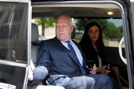 Lawyers Eric Dubelier and Katherine Seikaly leave U.S. District Court, following the arraignment of Concord Management and Consulting LLC, one of three entities and 13 Russian individuals indicted in an alleged criminal and espionage conspiracy to tamper in the 2016 U.S. presidential election, in Washington, U.S., May 9, 2018. REUTERS/Yuri Gripas