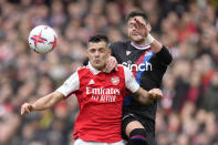 Crystal Palace's Joel Ward, right, challenges for the ball with Arsenal's Granit Xhaka during the English Premier League soccer match between Arsenal and Crystal Palace at Emirates stadium in London, Sunday, March 19, 2023. (AP Photo/Kirsty Wigglesworth)