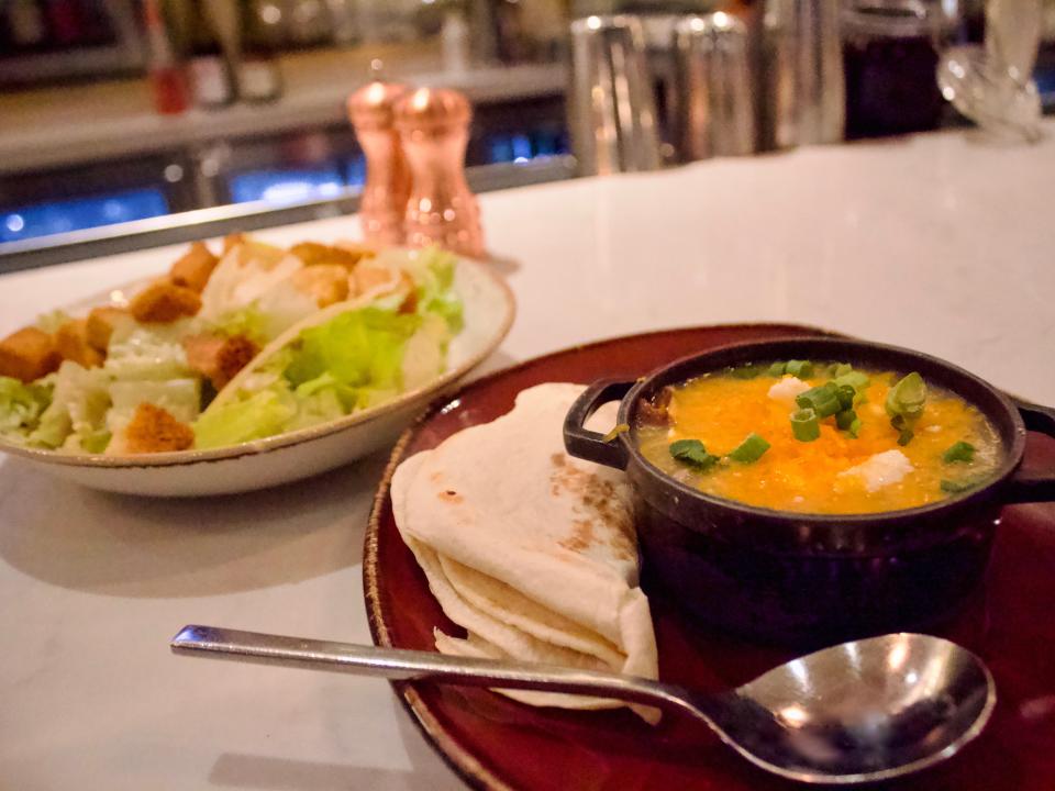 Green chile soup with a Caesar salad at Grill & Vine restaurant in the Westin Denver Airport Hotel