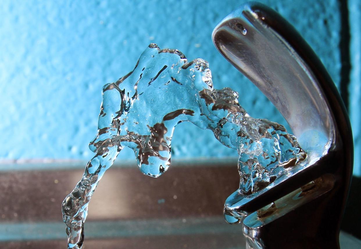 FILE - In this file photo, water flows from a water fountain at the Boys and Girls Club in Concord, N.H. 