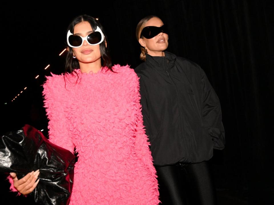 Kylie Jenner and Khloe Kardashian arriving at the SS23 Balenciaga show in Paris. (Getty)
