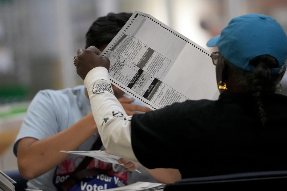 Election workers process ballots at the Clark County Election Department, Thursday, Nov. 10, 2022, in Las Vegas. (AP Photo/Gregory Bull)