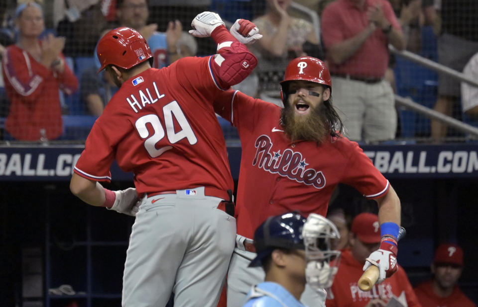 Philadelphia Phillies on-deck batter Brandon Marsh, right, congratulates Darick Hall (24) after Hall's solo home run off Tampa Bay Rays reliever Jake Diekman during the fifth inning of a baseball game Thursday, July 6, 2023, in St. Petersburg, Fla. (AP Photo/Steve Nesius)