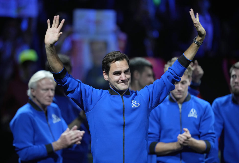 An emotional Roger Federer of Team Europe acknowledges the crowd after playing with Rafael Nadal in a Laver Cup doubles match against Team World's Jack Sock and Frances Tiafoe at the O2 arena in London, Friday, Sept. 23, 2022. Federer's losing doubles match with Nadal marked the end of an illustrious career that included 20 Grand Slam titles and a role as a statesman for tennis. (AP Photo/Kin Cheung)