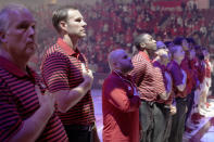 In this Wednesday, Oct. 30, 2019 photo, Nebraska head coach Fred Hoiberg, second left, stands with staff and players before an NCAA college basketball exhibition game against Doane University in Lincoln, Neb. Hoiberg knows the track record of Nebraska basketball coaches is not good. He wanted the job anyway. He takes over a program that has not won a conference championship in 70 years or ever won a game in the NCAA Tournament. He says a sold-out arena and top-notch facilities can trump the program's lack of tradition. (AP Photo/Nati Harnik)