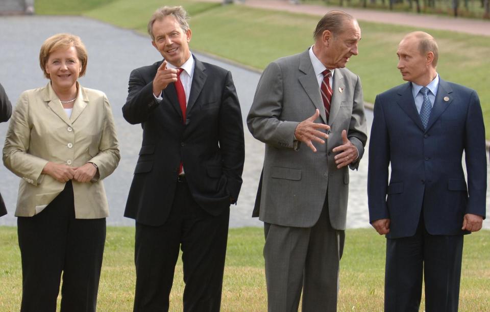 G8 leaders (left to right): Angela Merkel (Germany), Tony Blair (UK), Jacques Chirac (France), and Vladimir Putin (Russia) pose for a family photo at the G8 Summit in St. Petersburg, Russia.