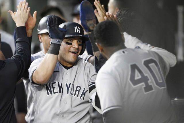 New York Yankees' Jose Trevino, left, celebrates his three-run home run with teammate Luis Severino (40) and others in the dugout during the fourth inning of a baseball game against the Baltimore Orioles, Monday, May 16, 2022, in Baltimore. (AP Photo/Nick Wass)