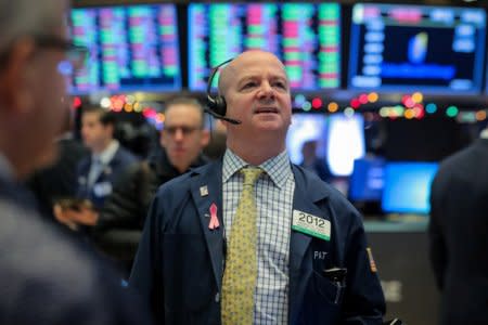 Traders work on the floor of the New York Stock Exchange (NYSE) in New York, U.S., December 10, 2018. REUTERS/Brendan McDermid