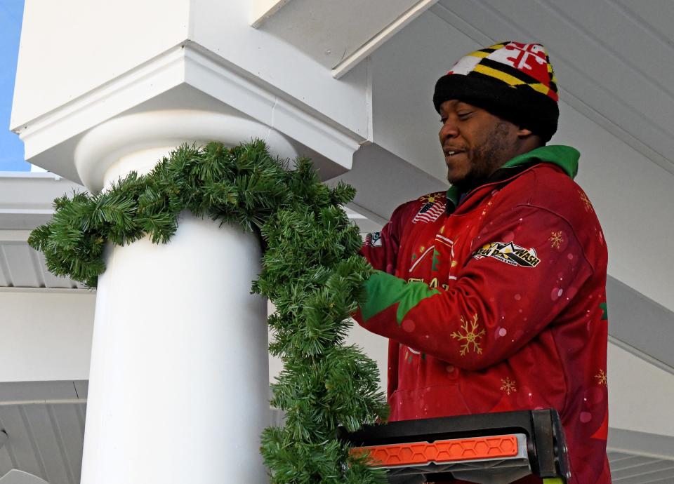 Aaron Moore, Delmarva Christmas Lights, strings lights to decorate The Lodge at Historic Lewes in Lewes, Delaware.