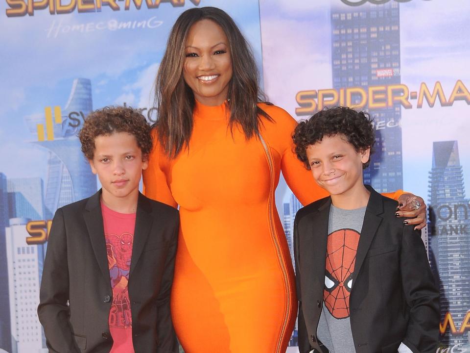 Garcelle Beauvais (C) and her sons Jaid Thomas Nilon (L) and Jax Joseph Nilon (R) attend the World Premiere of Columbia Pictures' 'Spider-Man: Homecoming' at TCL Chinese Theatre on June 28, 2017 in Hollywood, California